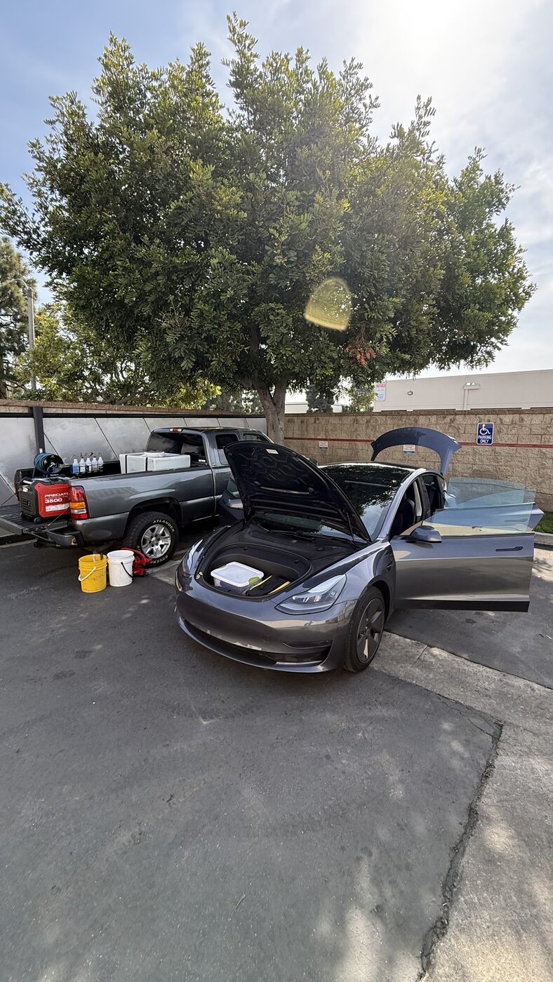 PacificBreeze mobile detailing setup working on a Tesla Model 3 in Orange County
